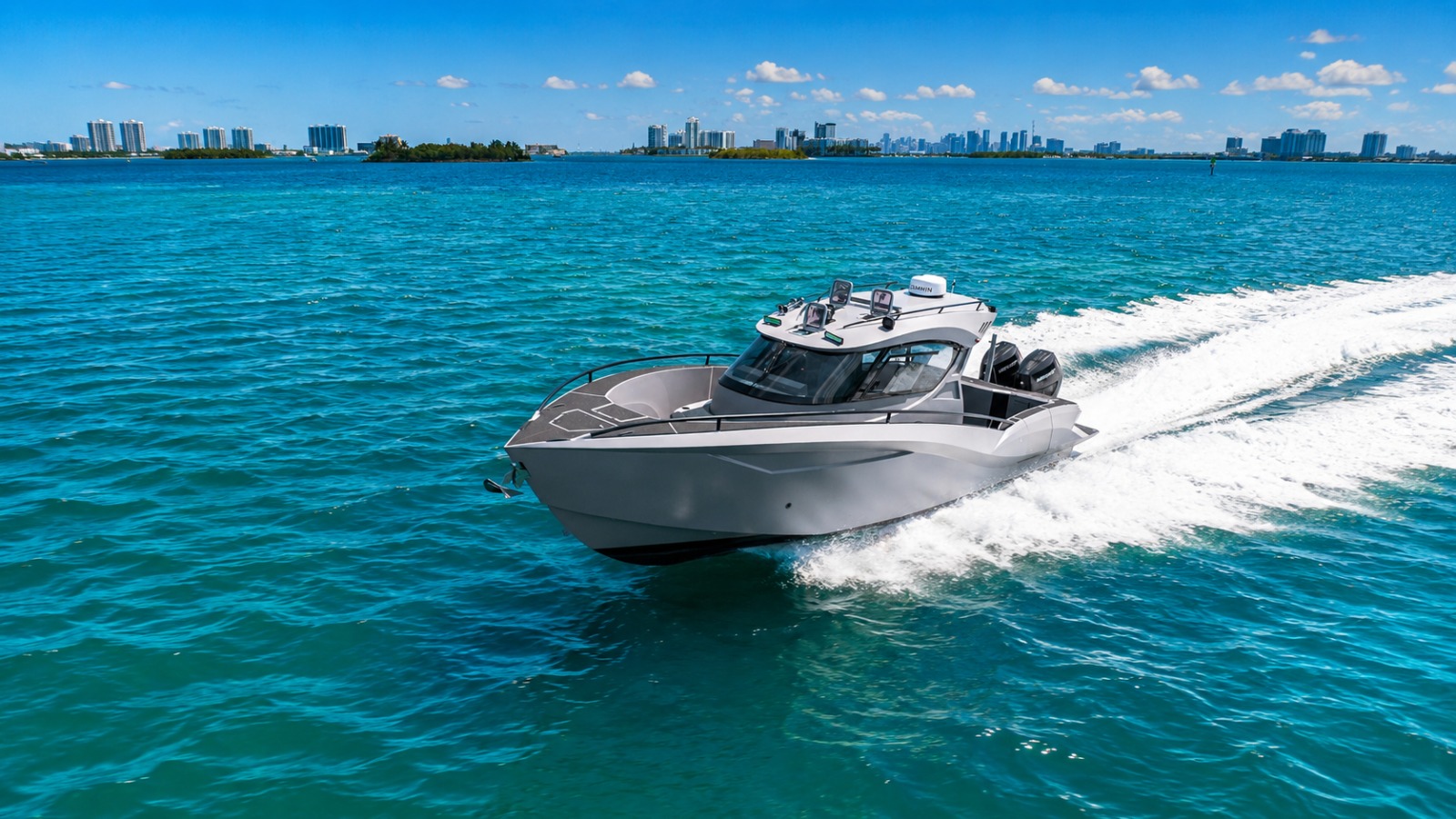 Novielli CERE 369 Signature performance vessel running across turquoise water with the Miami skyline in the distance.