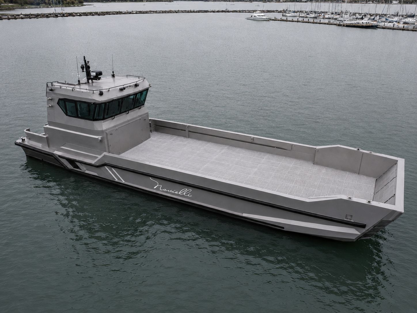 Novielli LC-509 M.U.L.E HD heavy-duty aluminum landing craft workboat with open cargo deck on calm harbor water.