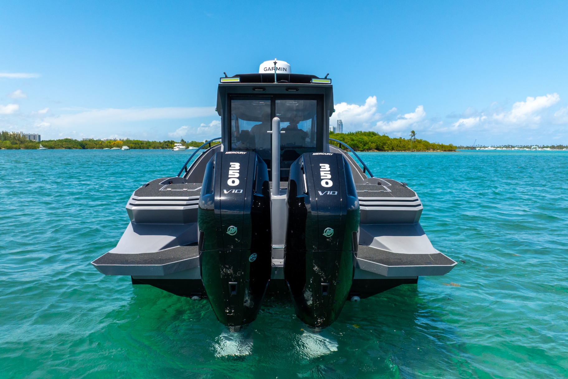 Stern view of the CERE 369 Signature with twin Mercury 350 V10 outboards and integrated swim platforms.