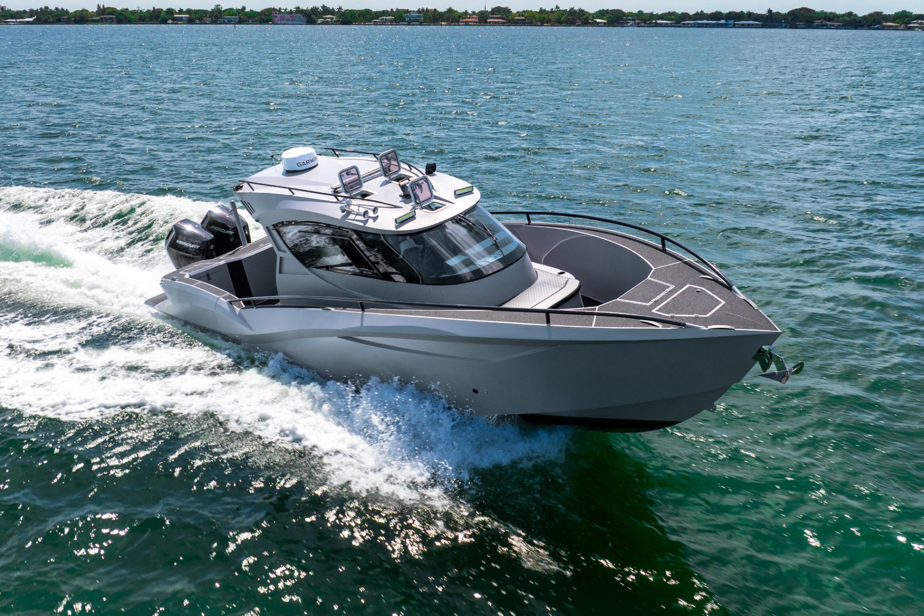 CERE 369 Signature carving a hard turn across the Intracoastal under power from twin Mercury V10 outboards.