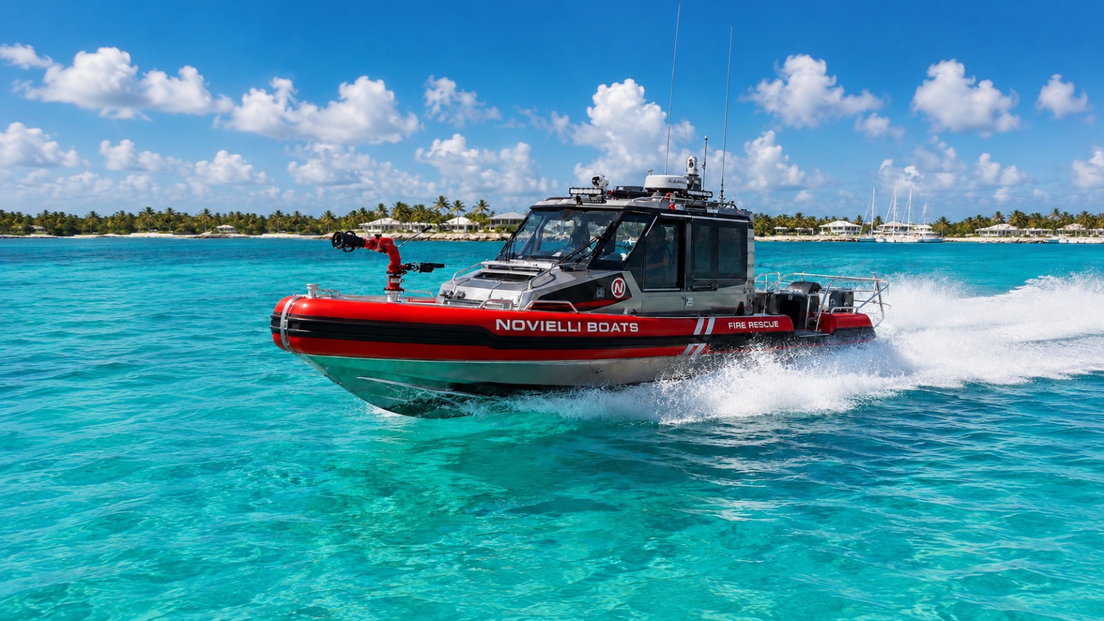 Novielli Inferno 299 Fire Rescue RIB with bow-mounted water cannon running at speed across turquoise tropical water.