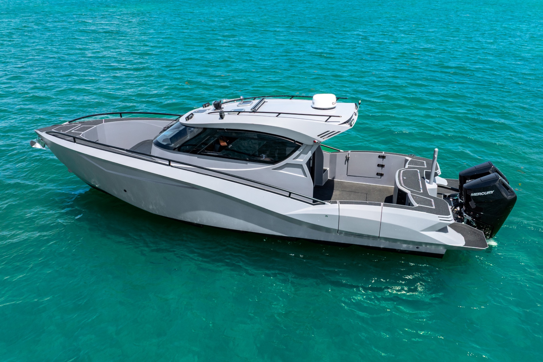 Port profile of the CERE 369 Signature drifting on turquoise water, hardtop and side windows visible.