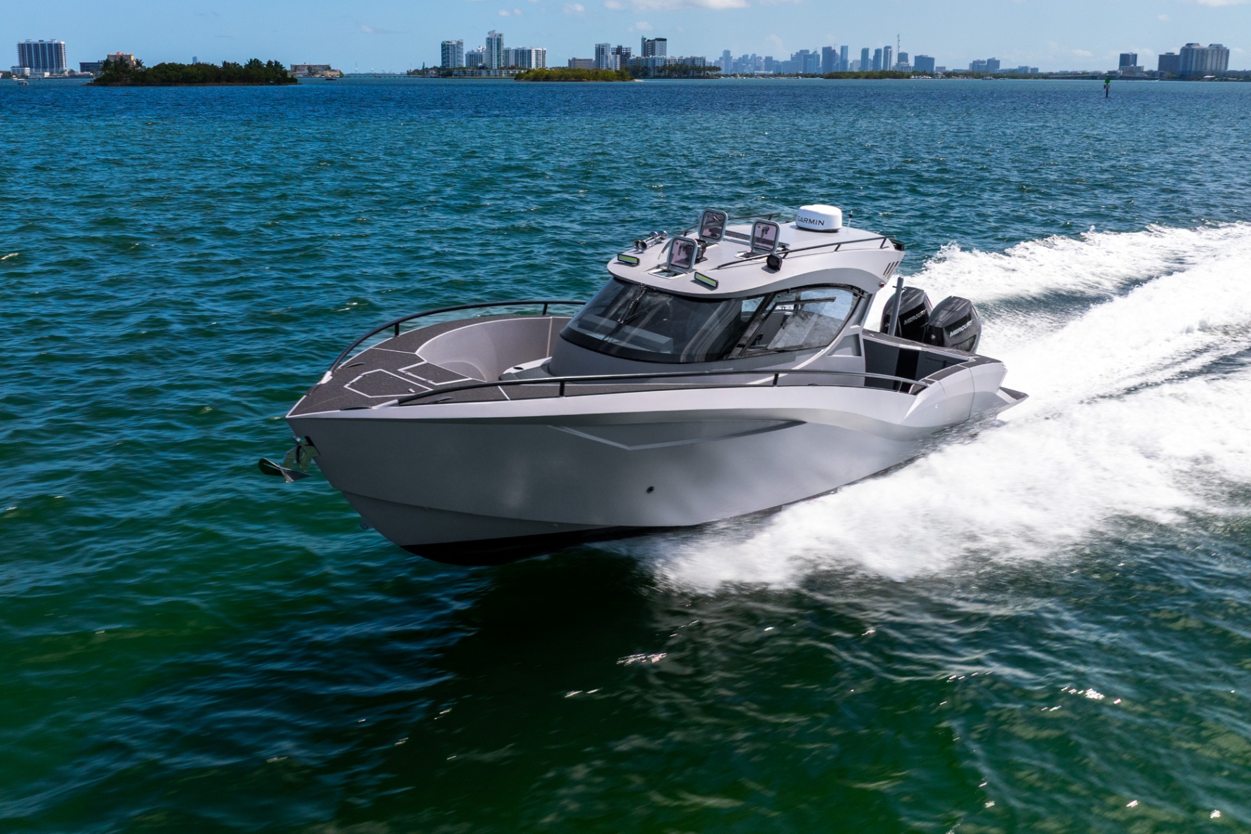 CERE 369 Signature running at speed with the Miami skyline in the distance.
