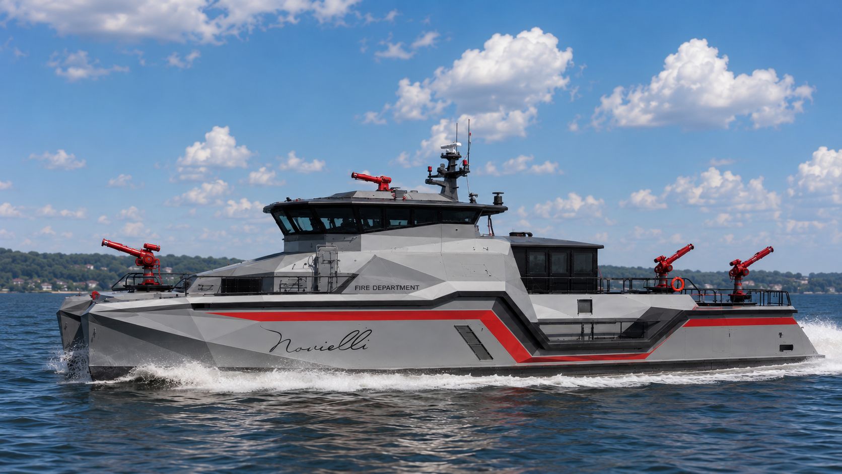 Bow-quarter running view of the Inferno LR 829 fire-rescue catamaran with red fire monitors and faceted aluminum hull.
