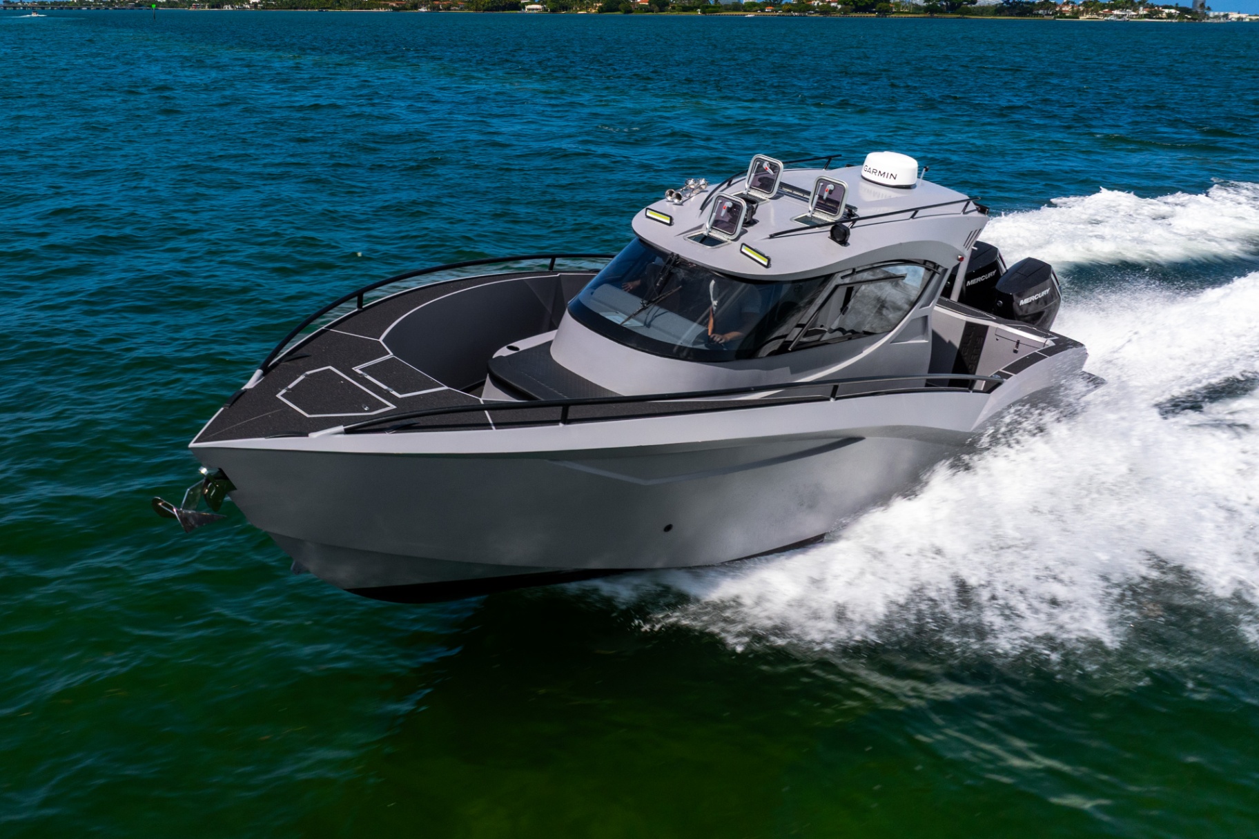 Bow-quarter view of the CERE 369 Signature running on Biscayne Bay, helm and hardtop visible.