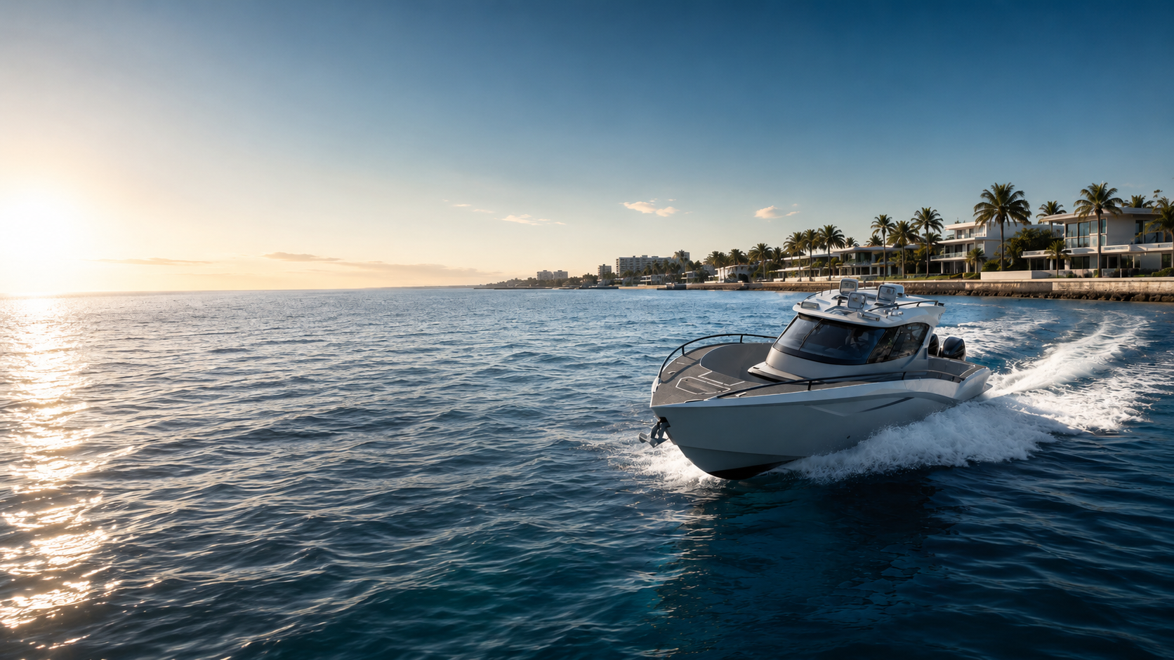 Novielli custom performance vessel running along a palm-lined coastline at golden hour.